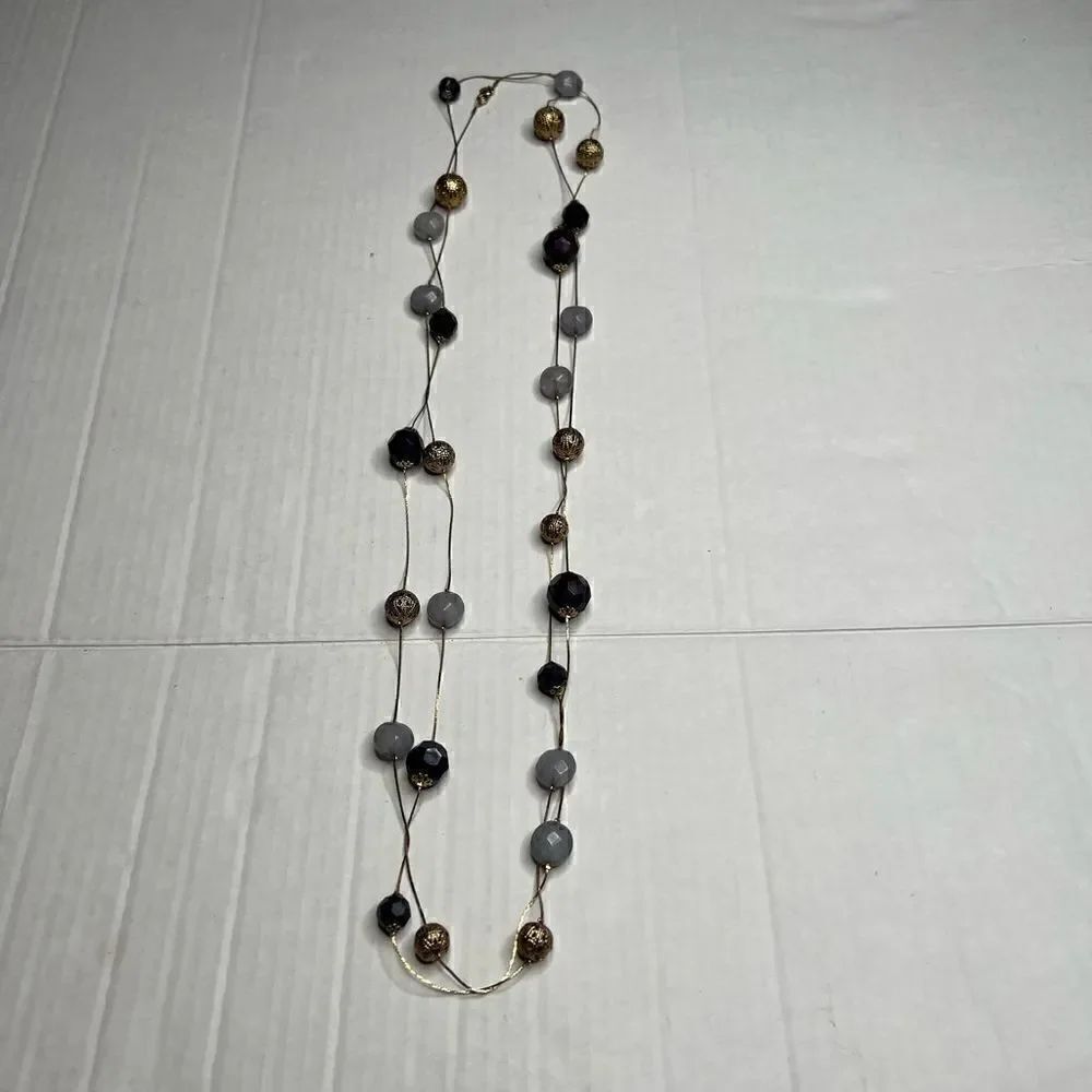 Gold tone long beaded and stone necklace